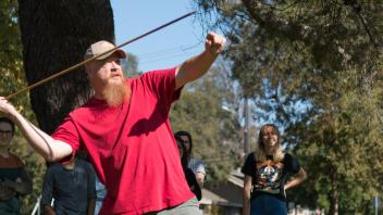 Professor Darwent throws an atlatl