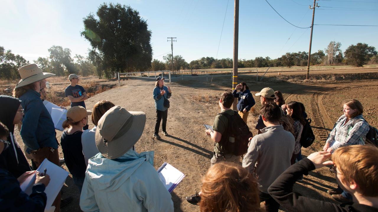 Kate Scow speaking to students outside