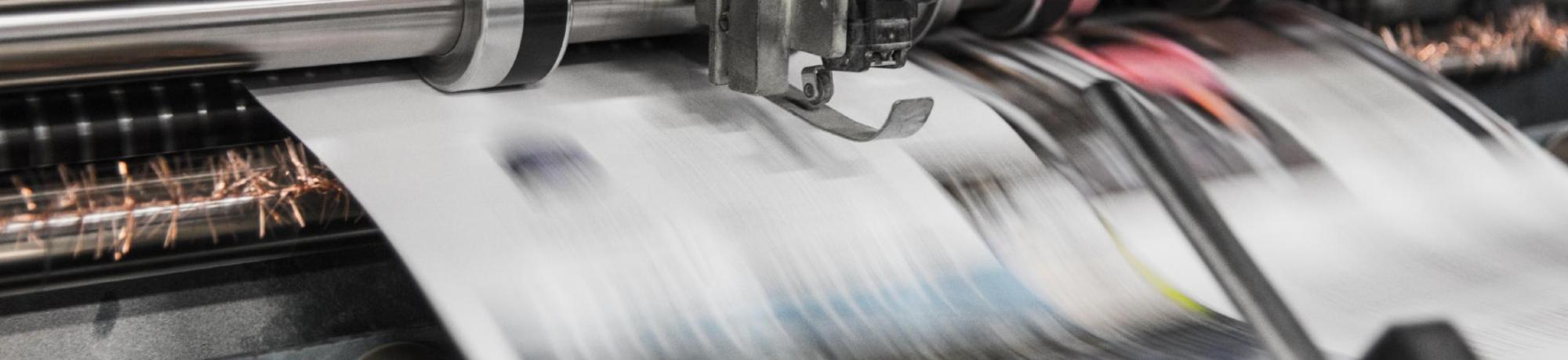 Newspaper, Photo by Bank Phrom on Unsplash